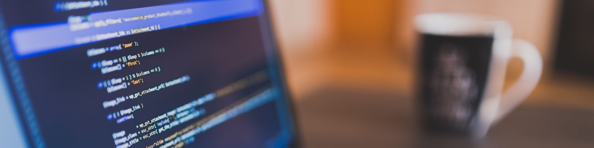 Banner image of computer and code